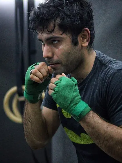 A fighter with his hands wrapped, ready to train. The wraps protect the hands, which are a boxer's most important tools.