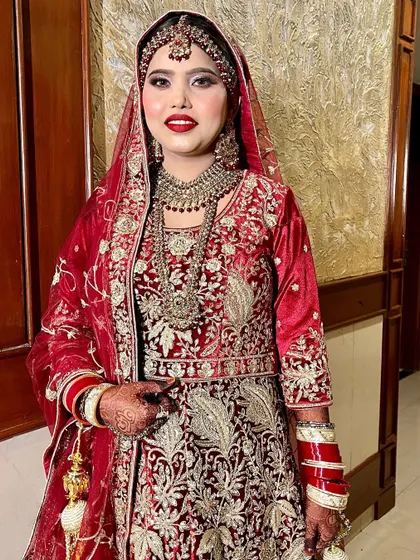 Our beautiful bride Sana, ready for her Nikah. We created a balanced look with shimmery eyes, a perfect red lip, and an HD base that looks like real skin.