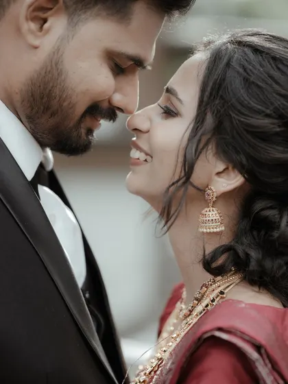 A classic, romantic close-up of the couple, capturing the love and happiness in their eyes.