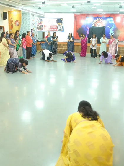 Teachers at the Indore workshop practicing an embodiment exercise. By physically becoming part of the story, they learn how to create immersive experiences for their students.