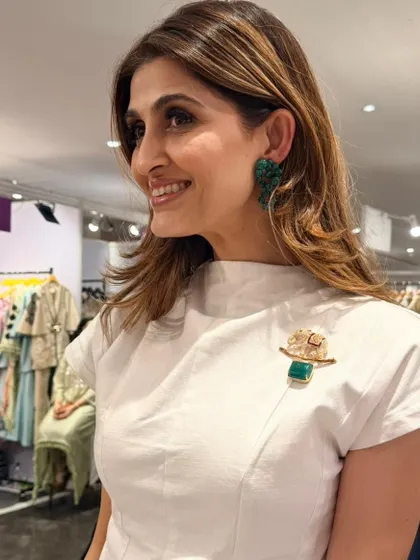 Another beautiful shot of my client Akanksha Malhotra. She perfectly styled my emerald cluster earrings and elephant motif brooch, showing how fine jewellery can add a touch of elegance to a simple, chic outfit.