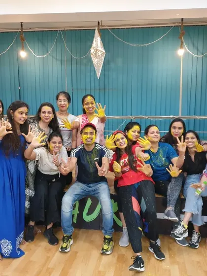 Another fantastic group picture from our Holi party, showcasing the vibrant and inclusive atmosphere at our studio.