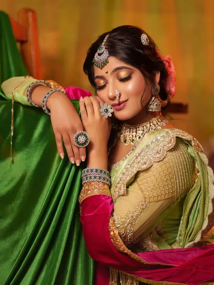 A portrait capturing the essence of the 'Peshwe Bai' character. With eyes closed, the focus is on the opulent jewelry and the serene yet powerful expression of a queen.
