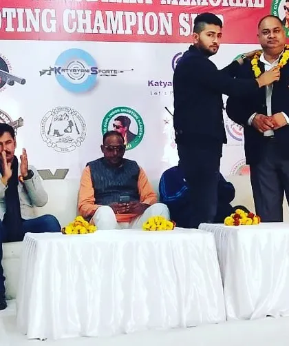 Our founder honoring a guest at a shooting championship. We are committed to fostering a culture of respect and sportsmanship within the shooting community.