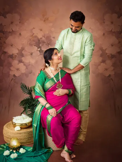 Another beautiful portrait of the couple, capturing a look of love and admiration. The soft floral background adds a touch of romance to the traditional theme.
