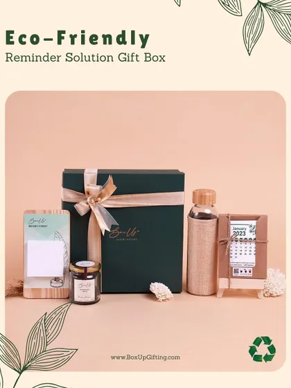 The Reminder Solution Gift Box is a perfect blend of sustainability and utility. It includes a glass bottle with a jute sleeve, a desk calendar, and a notepad with a wooden base.