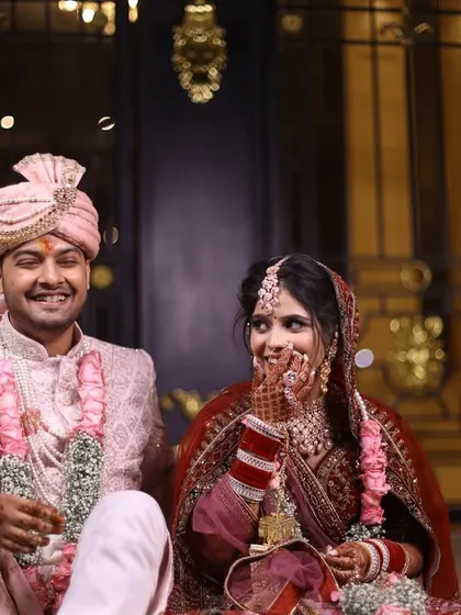 The groom's reaction during the joota churai negotiations, a priceless, candid moment.