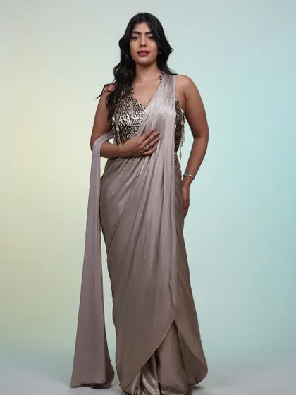 A full-length shot of the metallic saree, showing how the light plays on the shimmering fabric. It's a guaranteed head-turner.