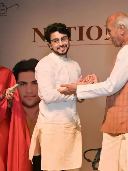 A candid moment on stage at the National Icon Awards, sharing a word with Honorable Jagdambika Pal ji.