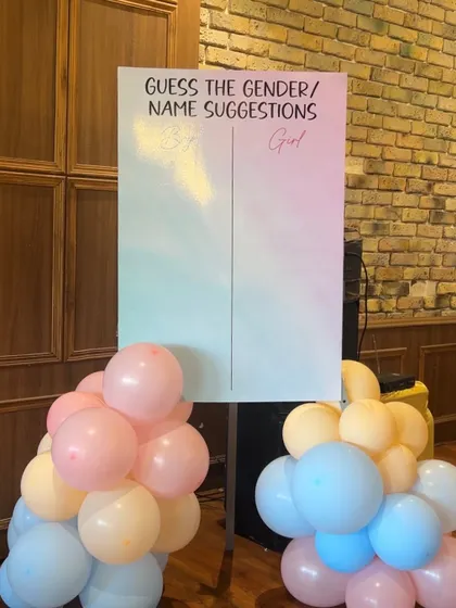A "Guess the Gender / Name Suggestions" board is a great way to get guests involved and create a lovely keepsake for the parents.