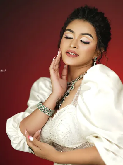 A serene and beautiful shot that highlights the artistry of the makeup.