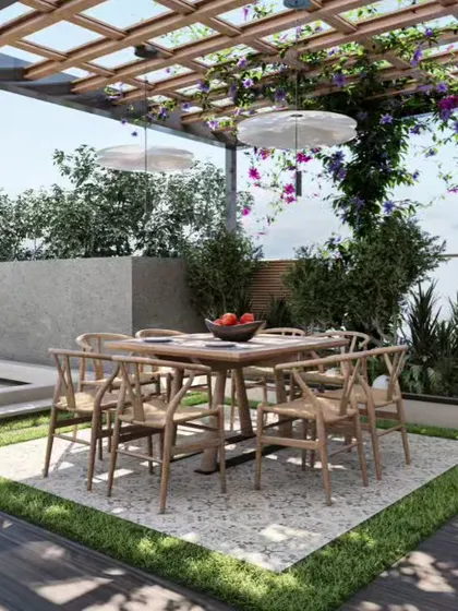 An elegant rooftop dining area under a pergola with climbing vines, perfect for entertaining guests outdoors.
