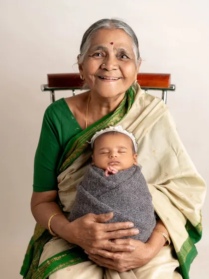 The pride and joy in a great-grandmother's smile says it all. It is an honor to document the connection between generations, preserving the family legacy with the newest member.
