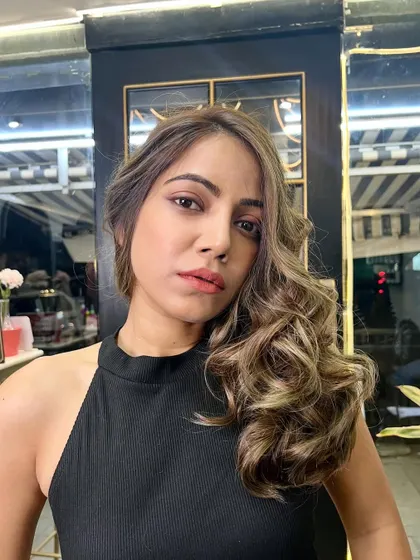 Another shot of the beautiful ash blonde look, showing how the color complements her skin tone perfectly.