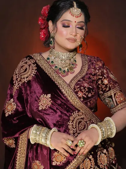 A detailed shot of a velvet bridal blouse with heavy embroidery. This shows the craftsmanship and quality of the pieces in our rental collection.