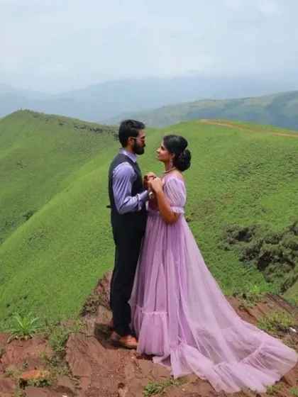 Our lavender gown with puff sleeves is perfect for a dreamy pre-wedding shoot in the mountains. The color stands out against the green hills.