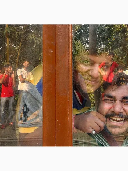 A reflection capturing a moment of celebration and friendship. The layers create a dynamic and joyful composition, blending different expressions and interactions into a single, energetic image.