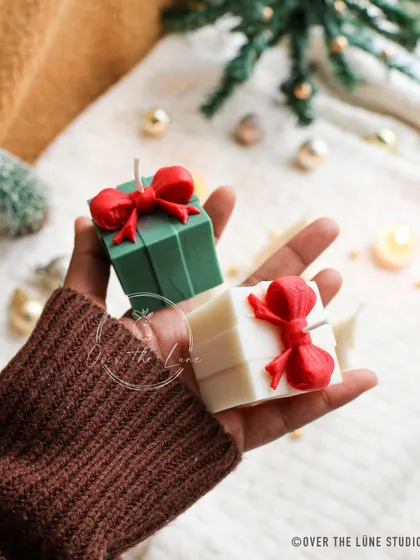 My little Christmas gift box candles are so fun. They come in festive colors with a bright red bow, perfect for scattering around your holiday decor.
