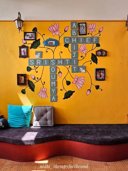 We can get really creative with custom designs. This unique wall combines a family name crossword puzzle with delicate Pichwai-style lotus art, creating a deeply personal and functional piece that holds both memories and beauty.