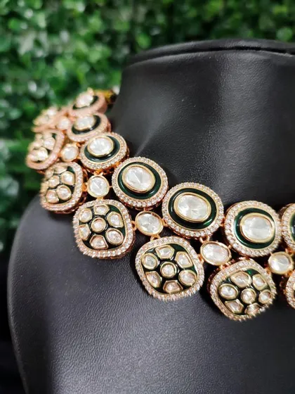 A close-up of the modern rental choker with black enamel and polki stones from image 9. This view highlights the unique design and craftsmanship.