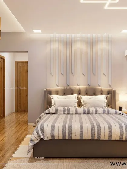 Another bedroom from 'Konark Oasis', featuring a beautiful tufted headboard against a textured wall with vertical grooves. The wooden flooring adds warmth to the minimalist design.