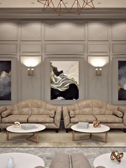 Another angle of the drawing room, highlighting the curated art pieces and layered lighting from sconces and a central chandelier.