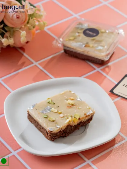 Where tradition meets indulgence. Our Kaju Katli Brownie is the perfect fusion, topping a rich, fudgy brownie with a layer of royal kaju katli, nuts, and silver varq.