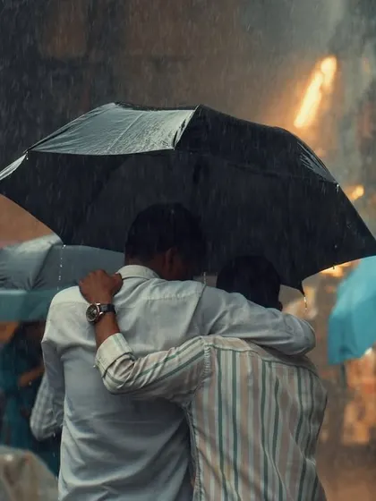 This is what I look for: real, unposed connections. Two friends sharing an umbrella in the pouring rain is a simple, powerful story of camaraderie. It’s these candid moments that make the most honest and memorable photographs.