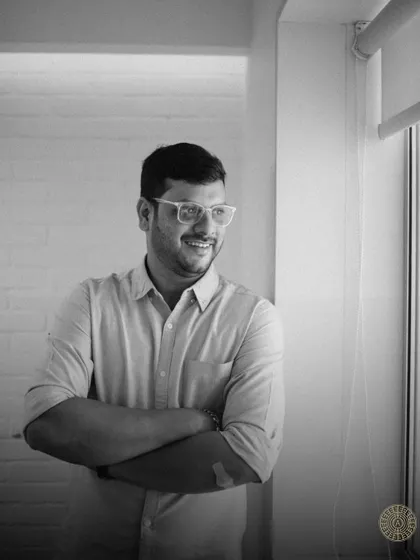 A black and white portrait of Amogh, our ever-smiling and dependable Project Manager.