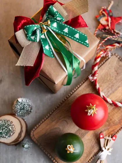 My handmade bauble candles look wonderful as part of a festive display. Here they are styled with a beautifully wrapped gift, ready to bring some Christmas cheer.