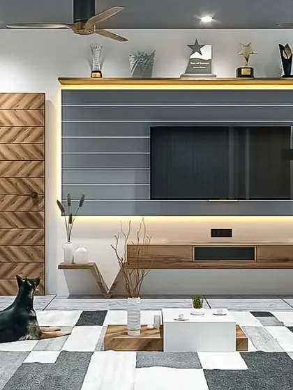 This living room design showcases a unique chevron-patterned door alongside a floating TV unit. The use of grey slatted panels and warm wood tones creates a sophisticated and textured look.