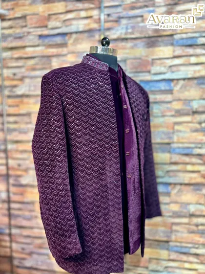 This angle captures the rich purple and wine tones of the velvet Jodhpuri suit.