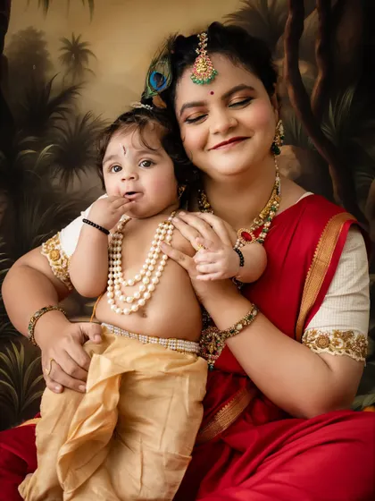 A sweet, candid close-up of a mother and her baby in their festive costumes.