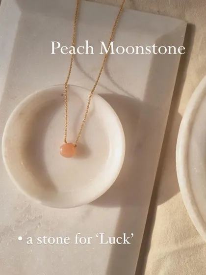 The Peach Moonstone heart drop pendant, a beautiful stone for luck.