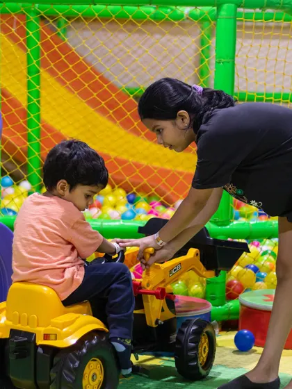 A helping hand from big sister makes the ride-on toy even more fun. We love seeing siblings create happy memories together here.