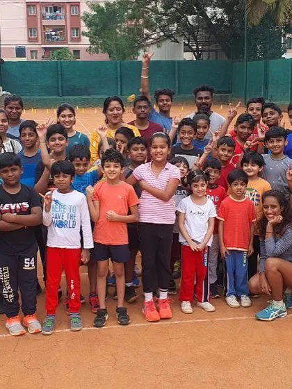 All smiles on the court. This group represents the diverse range of players at my academy, from young kids starting their tennis journey to more experienced players in our advanced batches.