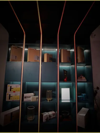 Our Experience Center showcases the products and technologies we integrate. The shelves are lined with smart devices and controls, all illuminated by our dynamic, color-changing linear lights.