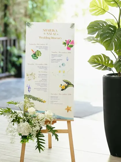 A custom itinerary sign for the destination wedding, keeping guests informed of the festivities.