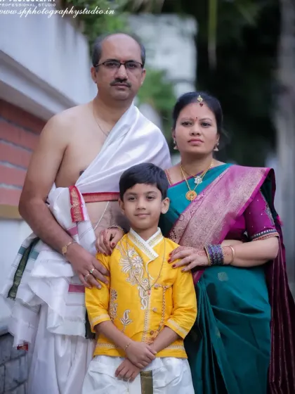 A formal outdoor family portrait. We pay close attention to posing and composition to create a balanced and professional photograph that serves as a perfect family record.