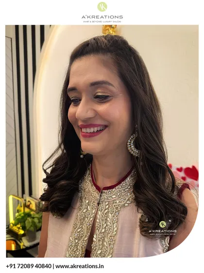 A happy client ready for her event. We created a soft glam makeup look with a shimmering eye and paired it with a waterfall braid hairstyle.