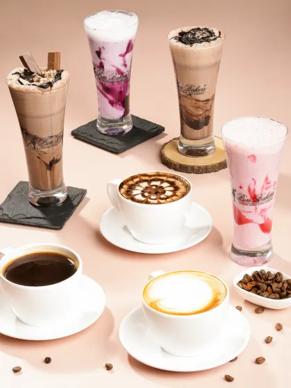 Showcasing a full range of beverages requires careful composition and lighting. This group shot for a bakery highlights the variety of their coffee and shake menu in a single, appealing image.