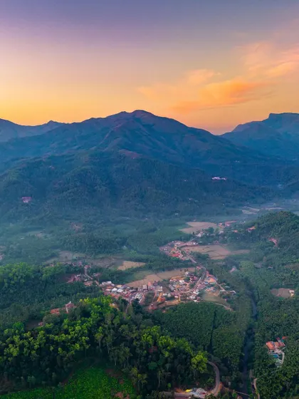 An aerial view of the town of Hornadu nestled in the Western Ghats at sunset. This was from a trip focused on serene immersion in nature, a contrast to my usual whirlwind road trips.