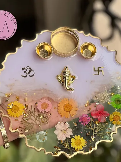 A beautiful Pooja Thali with a white and lilac marble effect. The combination of colors and flowers makes it a truly special piece.