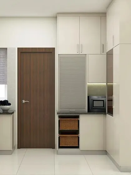 A compact kitchen design where every inch is utilized. This layout includes pull-out vegetable baskets and a roller-shutter unit to neatly conceal appliances.