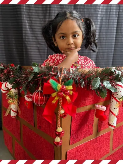 A thoughtful pose in our Christmas chimney prop. Each child gets their moment to shine during our festive photoshoots.
