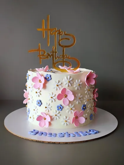 Everything floral for Anushika. This 1kg chocolate truffle cake is covered in delicate pink and purple buttercream flowers, perfect for a teen's birthday.