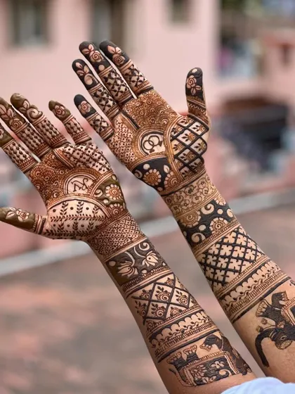 A duplicate image of the full-arm engagement mehendi, providing another clear view of the detailed artwork.