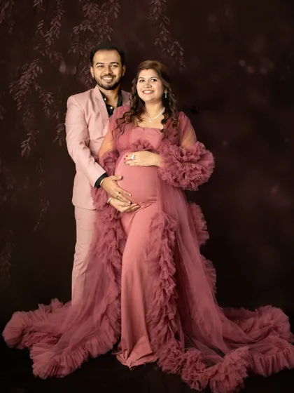 A beautiful, formal portrait of the couple. The flowing gown and the smart suit create a timeless look, perfect for celebrating this milestone.