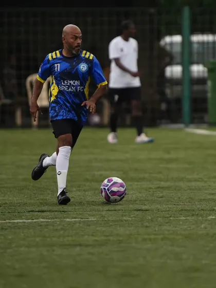 One of our veteran players skillfully controls the ball and advances up the pitch. Our team is built on experienced players who still have the drive and technique to compete at a high level.