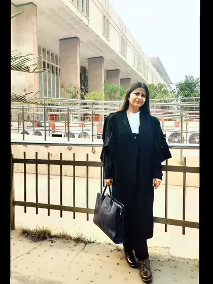 Dressed in my advocate's gown outside the Delhi High Court. The uniform is a symbol of my responsibility to the law and my clients.
